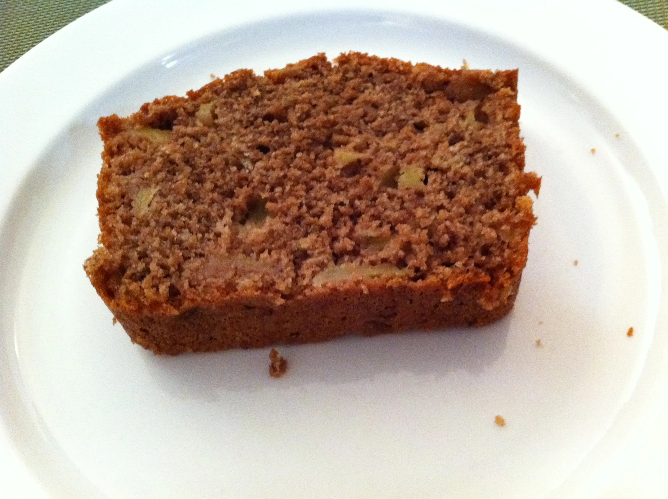 a brown bread sitting on top of a white plate