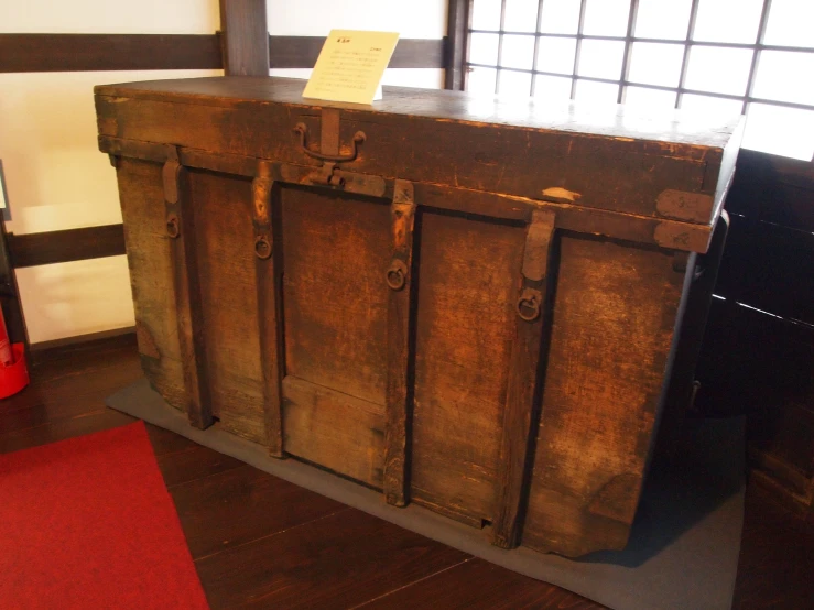 old wooden trunk sitting in the middle of a room