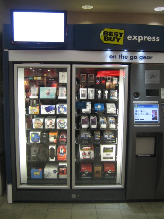 two vending machines are displayed in an airport