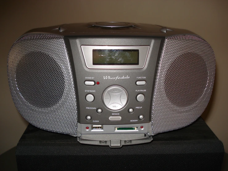 a large silver radio sitting on top of a table