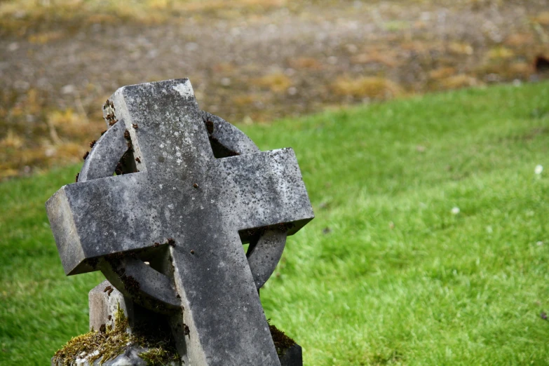 the back of an old fashioned, carved cross