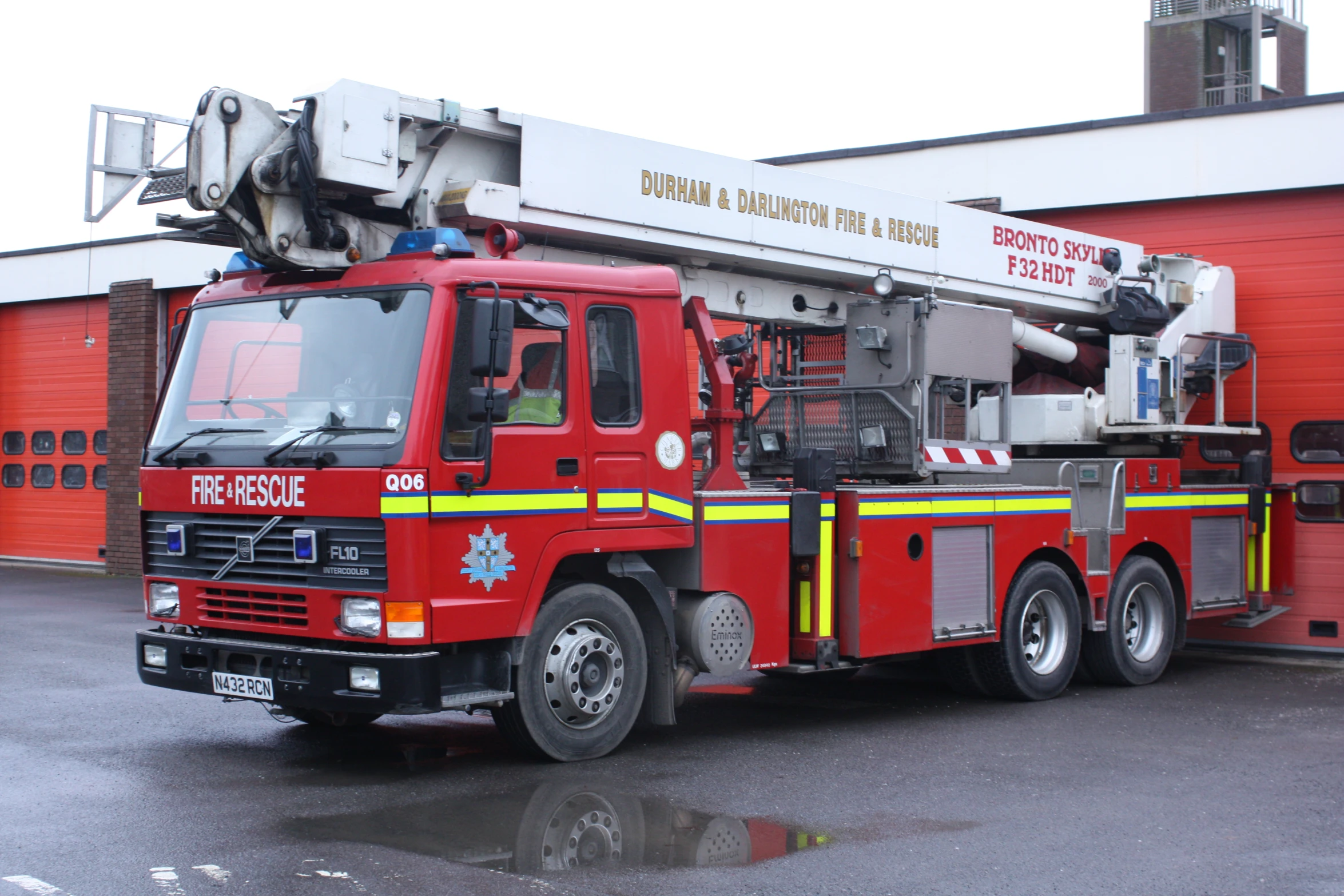 an emergency truck parked in front of a fire department