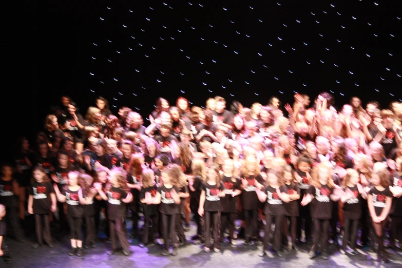 a group of musical performers holding their instruments and singing