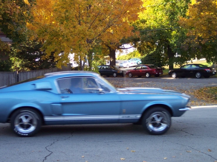 a very nice old mustang, with the hood down