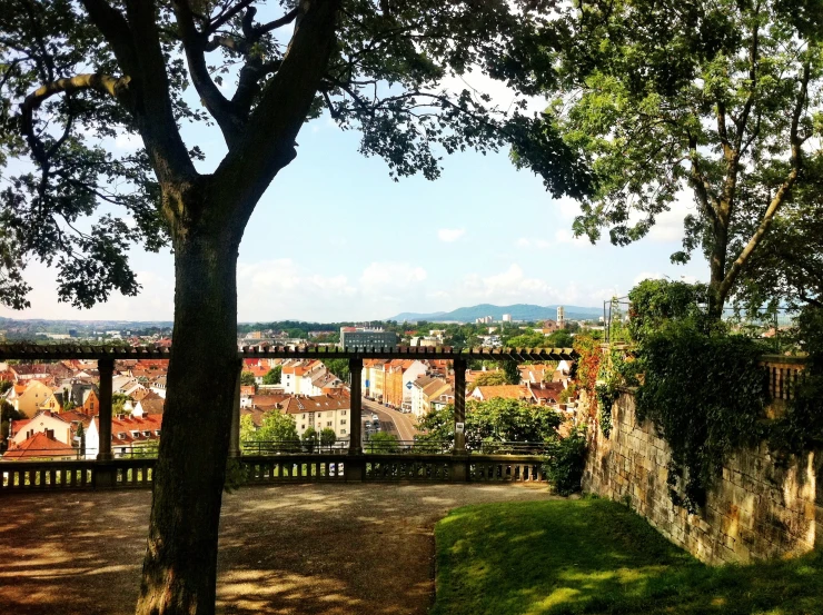 a view of the city from above trees