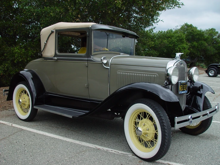 a antique model ford parked in a parking space