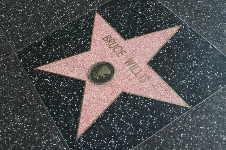 a star on the hollywood walk of fame is being displayed for viewing