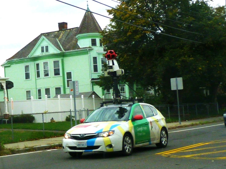 the car is painted with colorful paint stripes