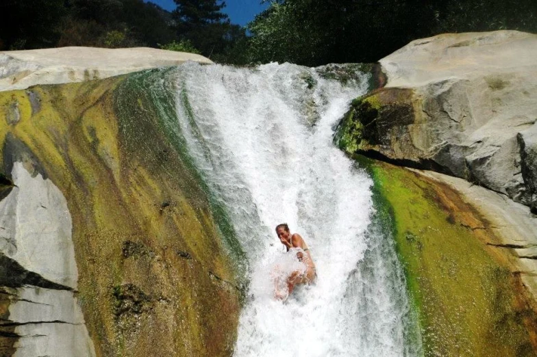 the woman is riding a board on the water