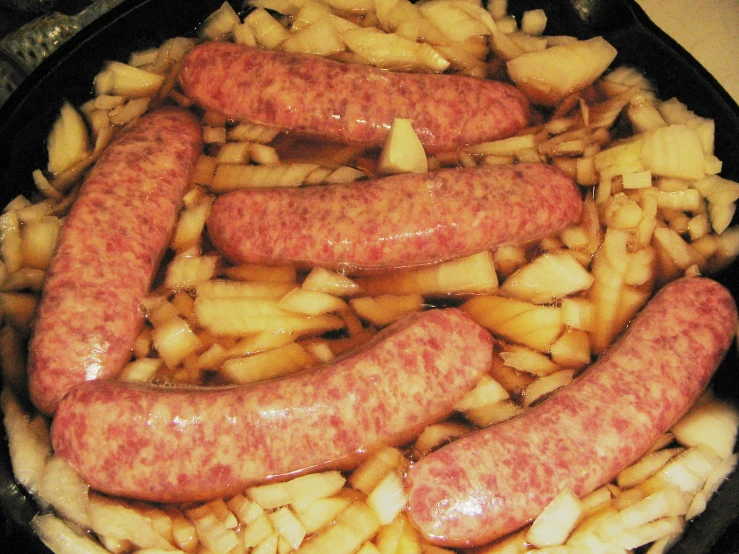 there are lots of grilled sausages and potatoes in a set