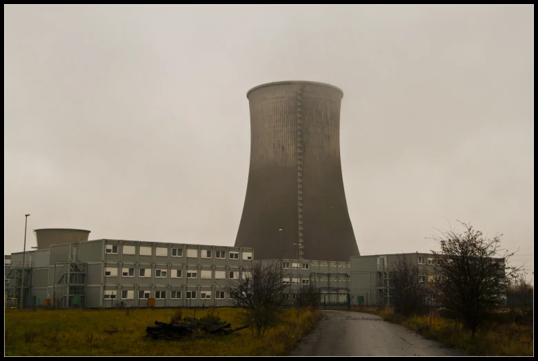 a road going past a huge building with a tower