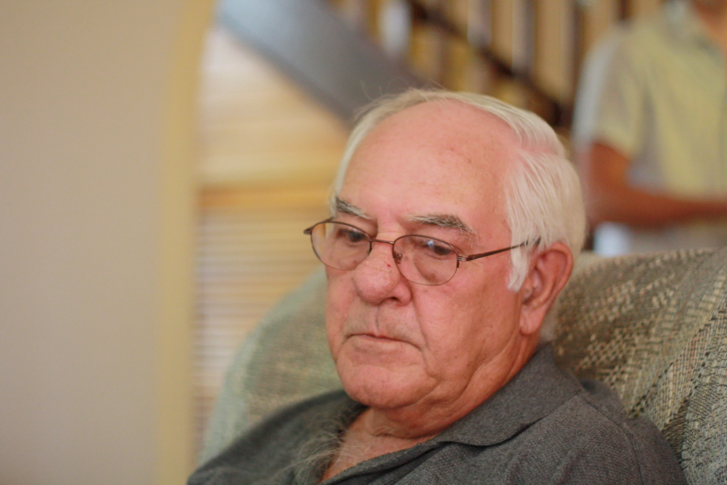 a man sitting down and looking at soing