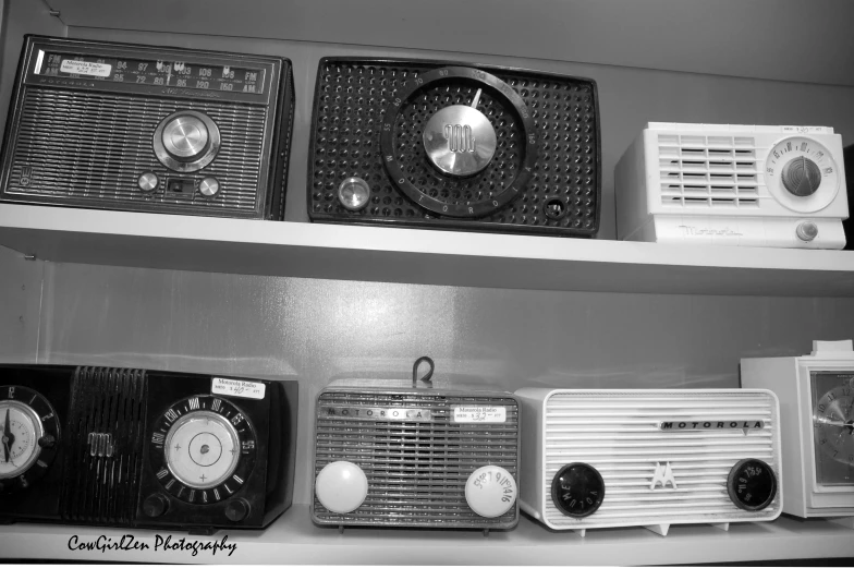 a black and white image of old radio's