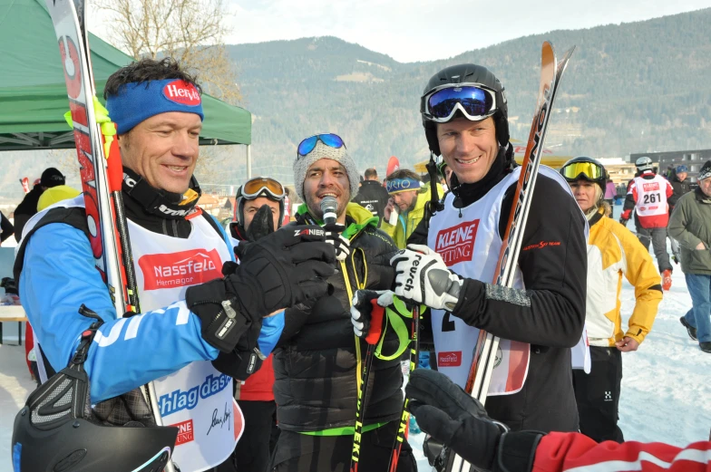 a group of men on skis standing next to each other