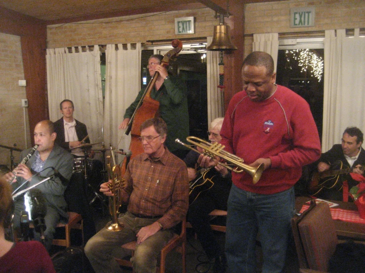 a jazz band is in a group playing instruments