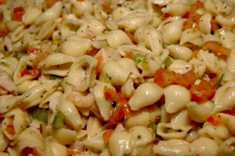 closeup of macaroni and cheese mixture displayed in square dish