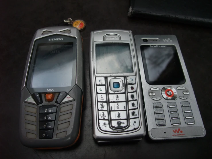 a couple of smart phones on a table