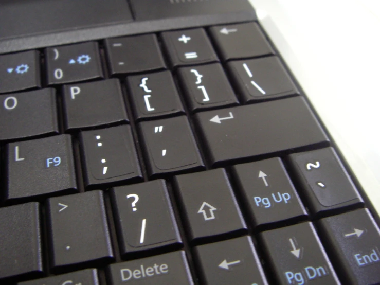 an angled view of an open laptop computer keyboard