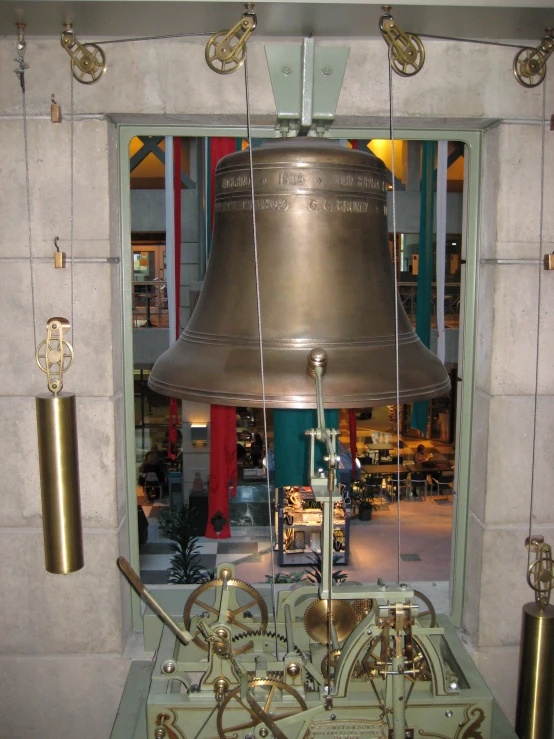 a bell sits in a room with a window