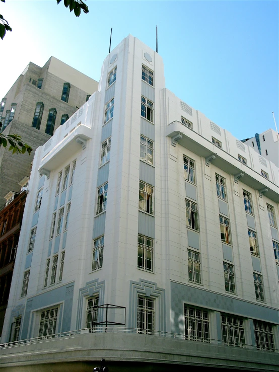 an art deco style building with multiple levels of windows