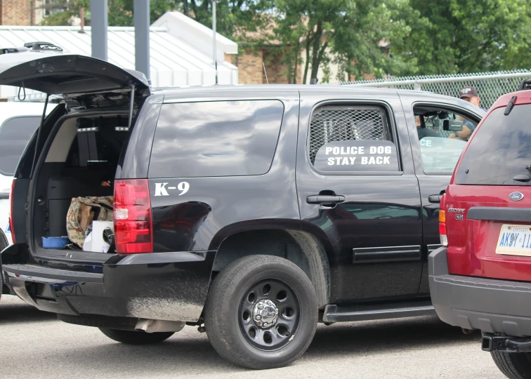 a parked van with two dogs inside of it