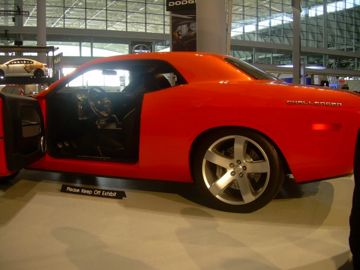 a red sports car in an auto show