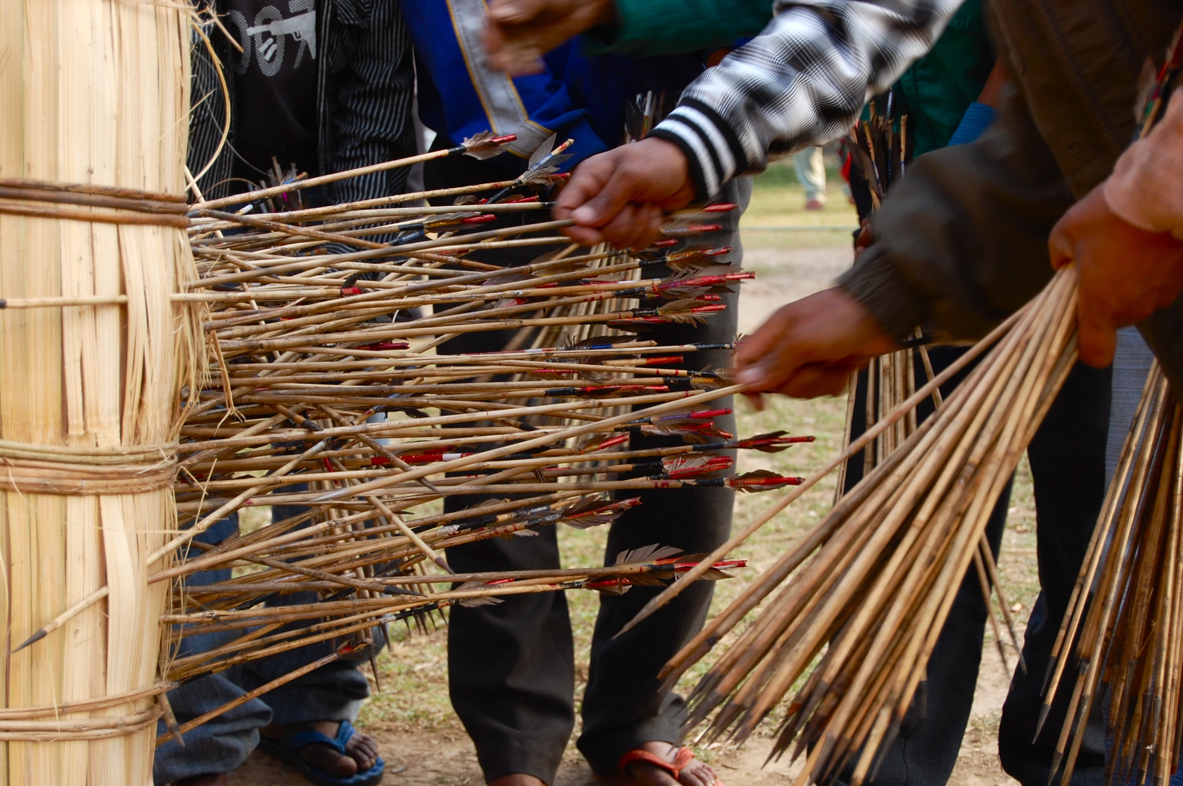 a bunch of people trying to make a stick structure