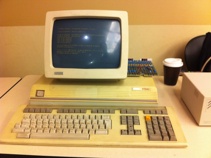 a computer monitor sitting on top of a desk