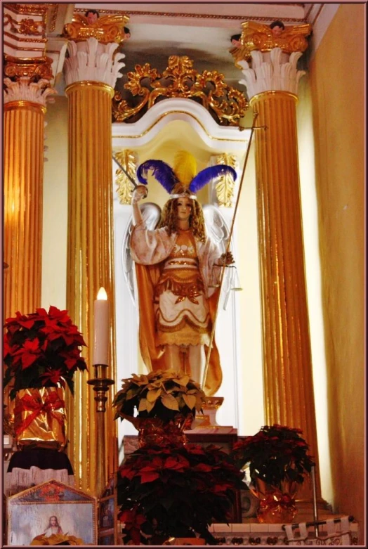 the statue of jesus christ is surrounded by golden pillars