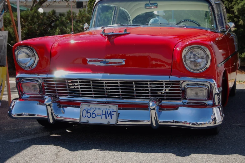 a red and white car in a parking lot