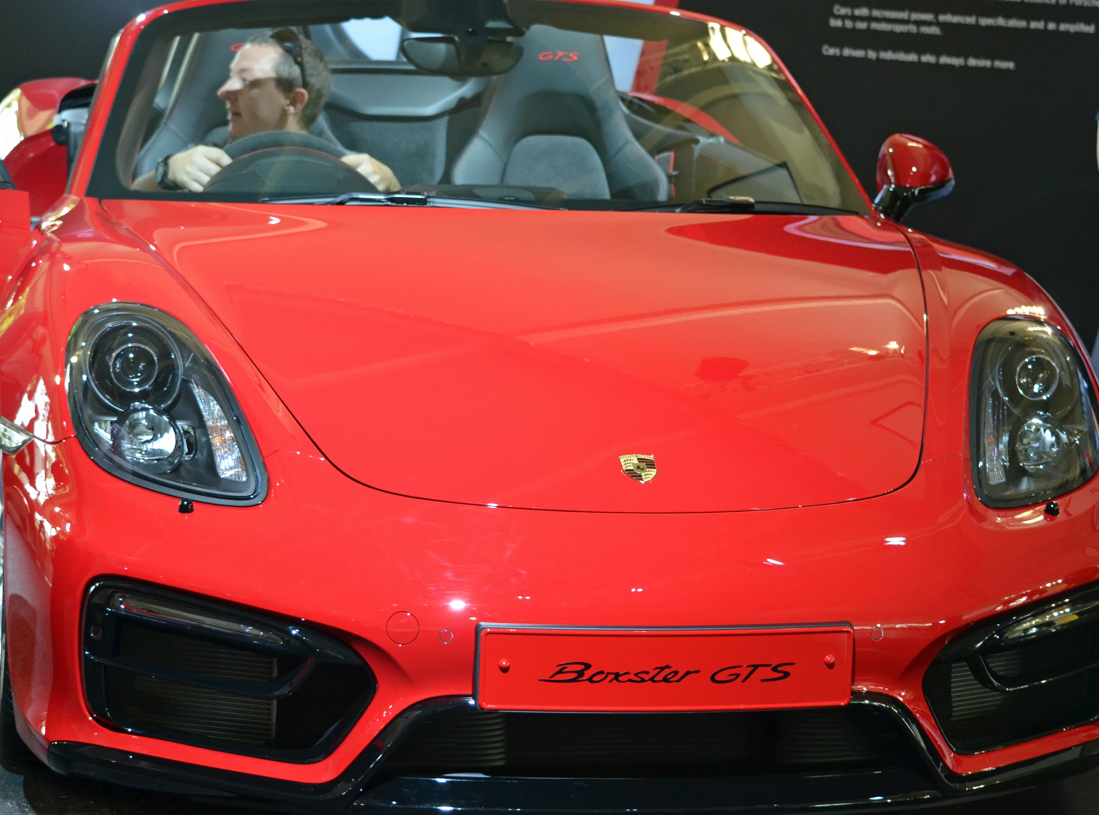 red sports car with front seats up at the top