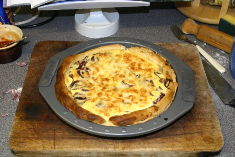 a pie sitting on a pan on top of a wooden counter