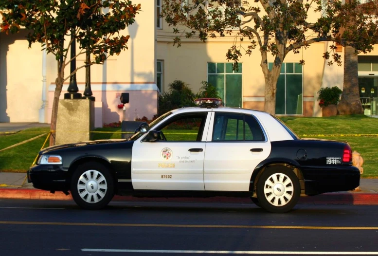 a police patrol car parked on the side of a street
