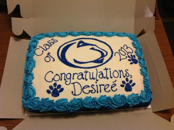 a cake is displayed with congratulations's and dogs written on it