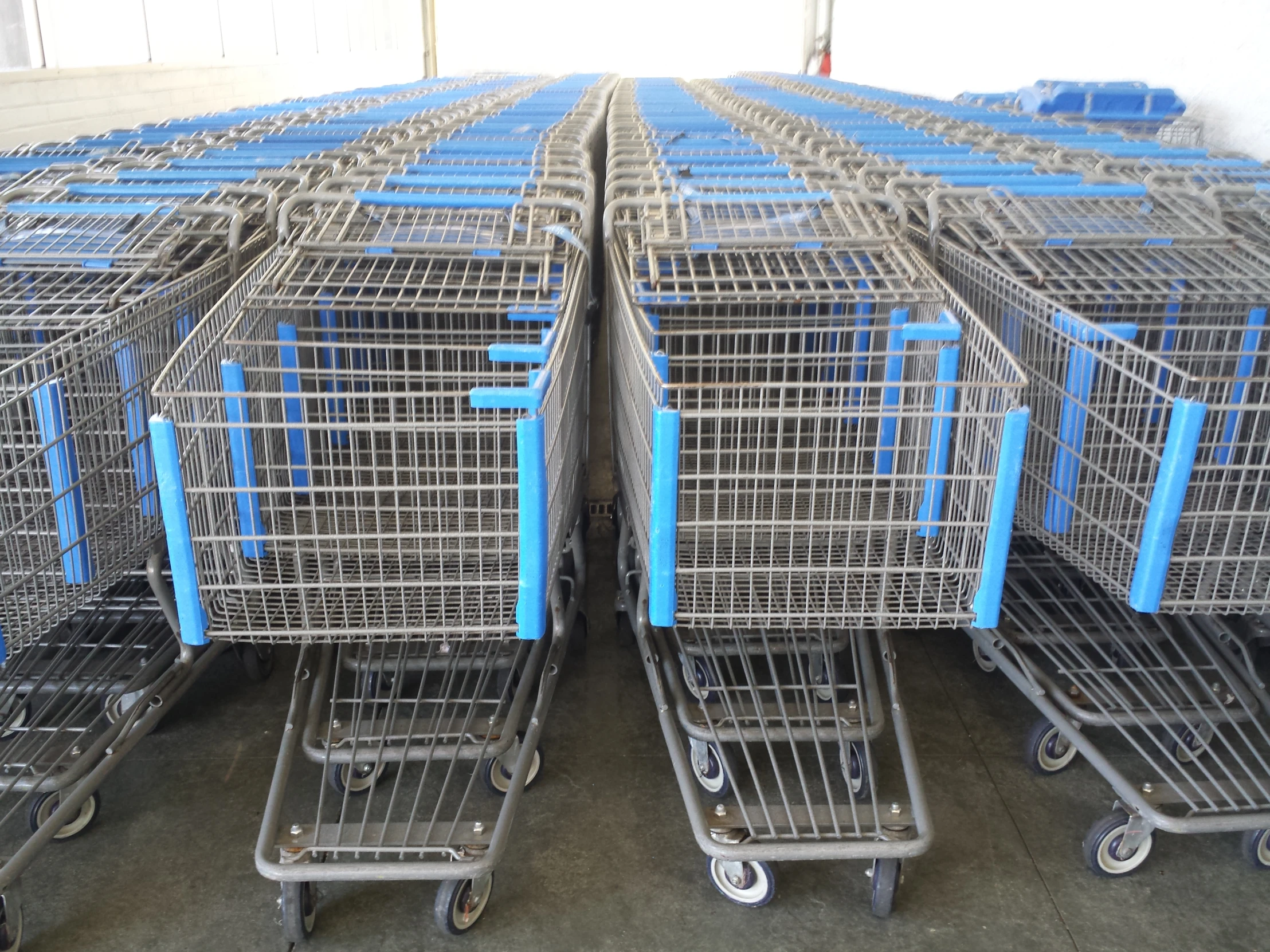 shopping carts sit stacked together on the floor