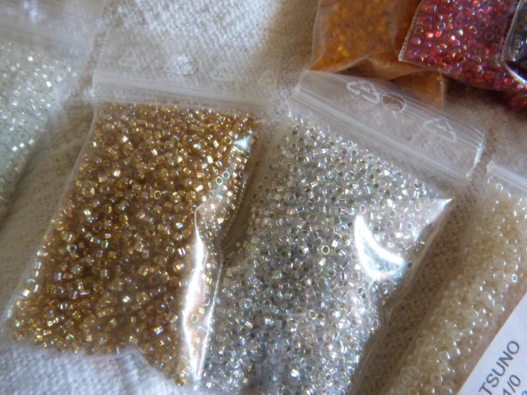 three different glitters are sitting together in a package