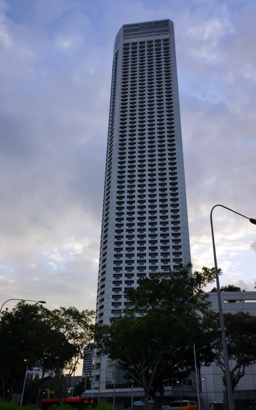 the building has a lot of windows and people standing outside