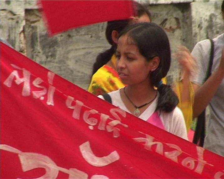 a child with a red flag that says tibet