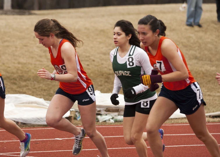 girls on the track running together