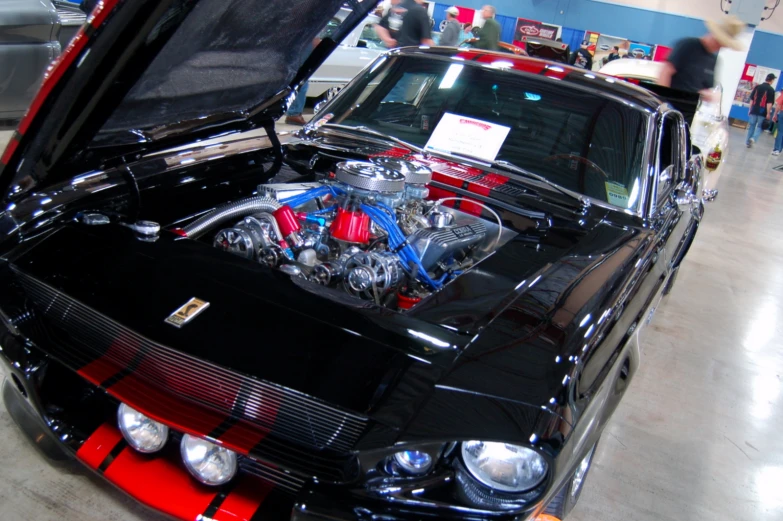 an engine on the hood of a black car