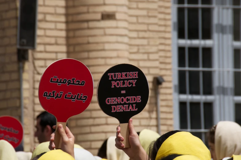 a group of people holding up signs with one reading truth truth