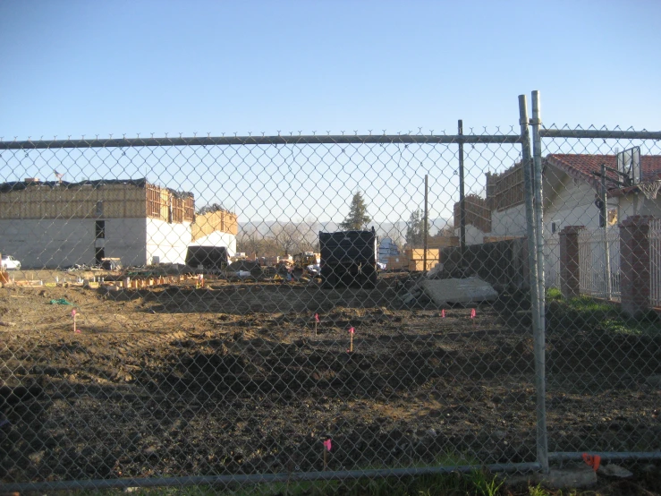 a fence has been erected near an abandoned building