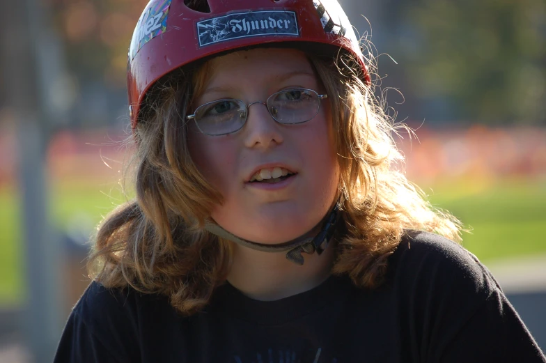 a  wearing glasses and a helmet