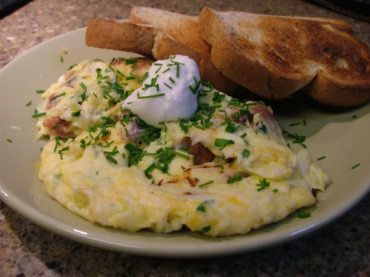 there is some eggs and toast on the plate