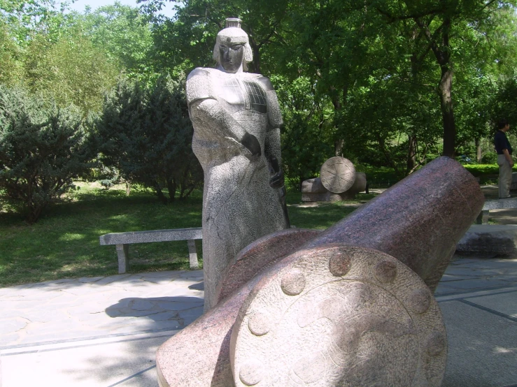 a close up of a giant metal gun statue