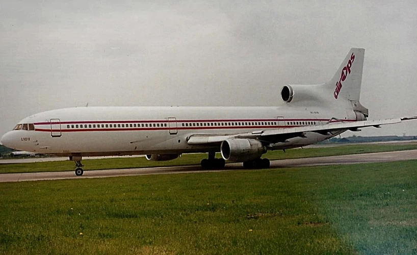 an airplane on the ground sitting at the airport