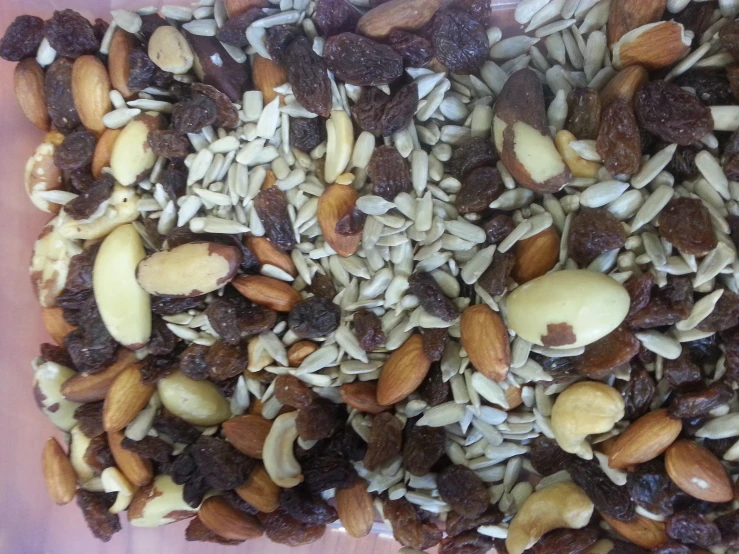 nuts, raisins and chocolate are mixed in together