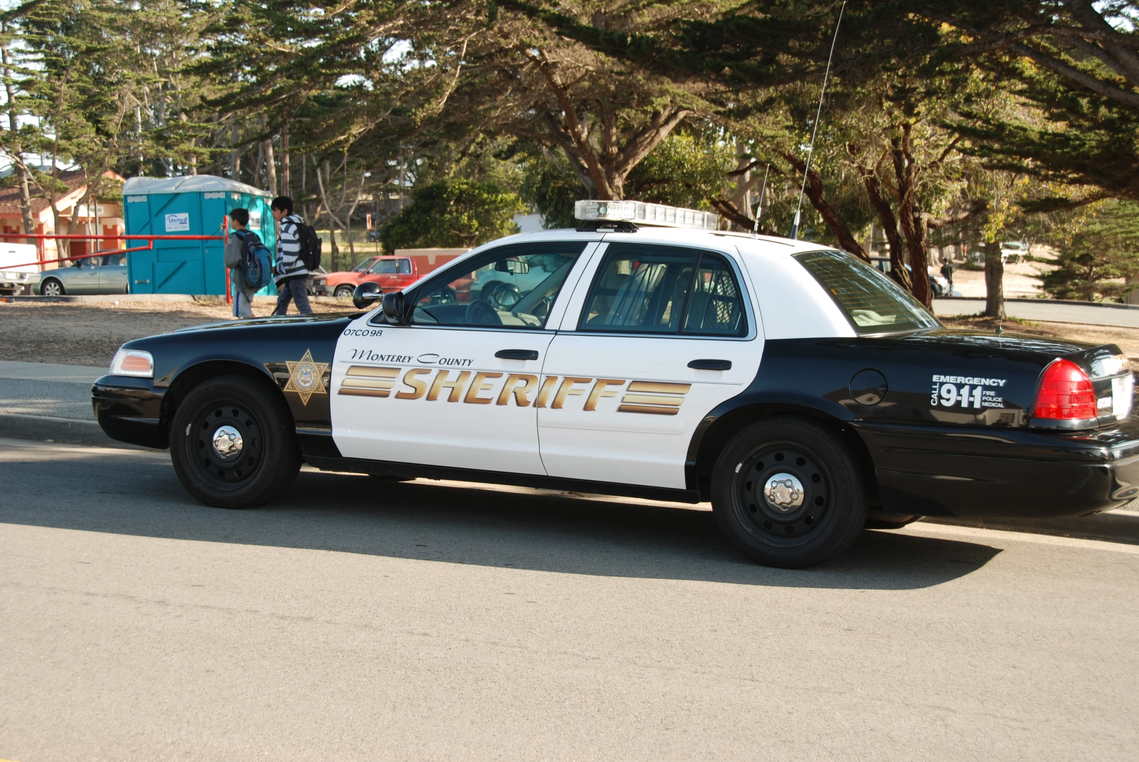 a police car is parked on the side of the street