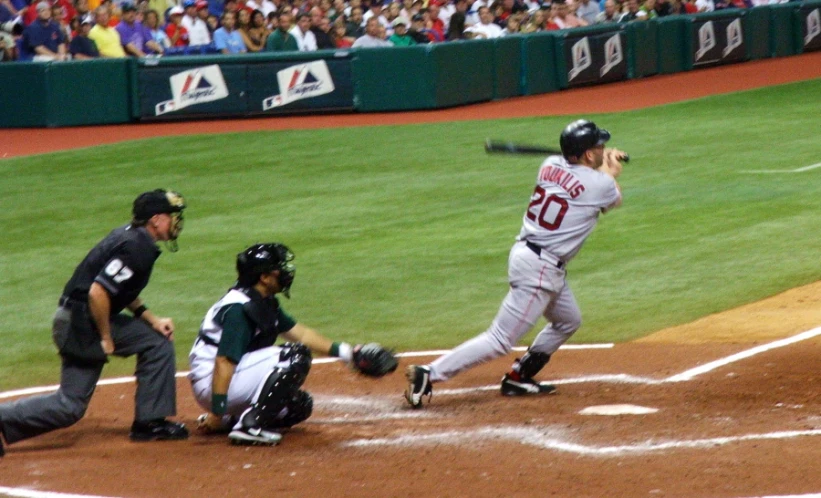 a baseball player hitting a ball during a game