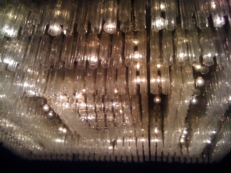 several rows of light bulbs sitting on top of a ceiling